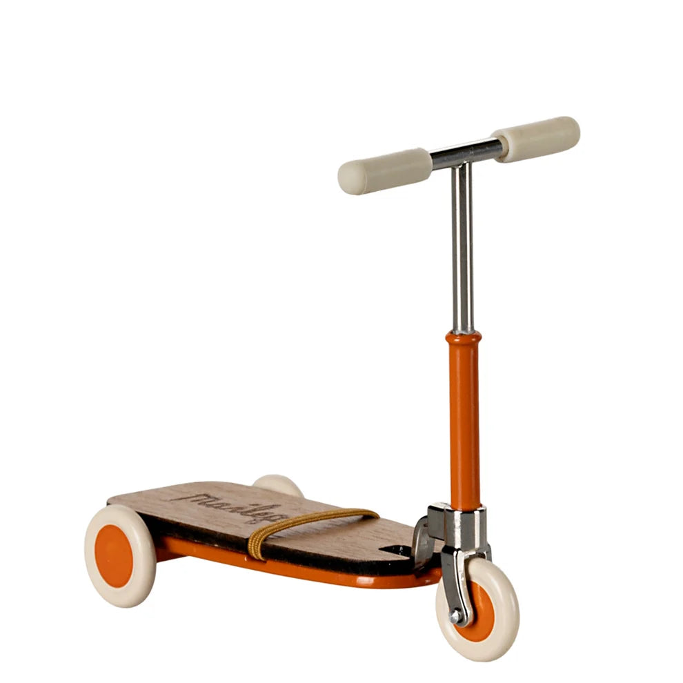 Children's scooter with orange accents on a white background