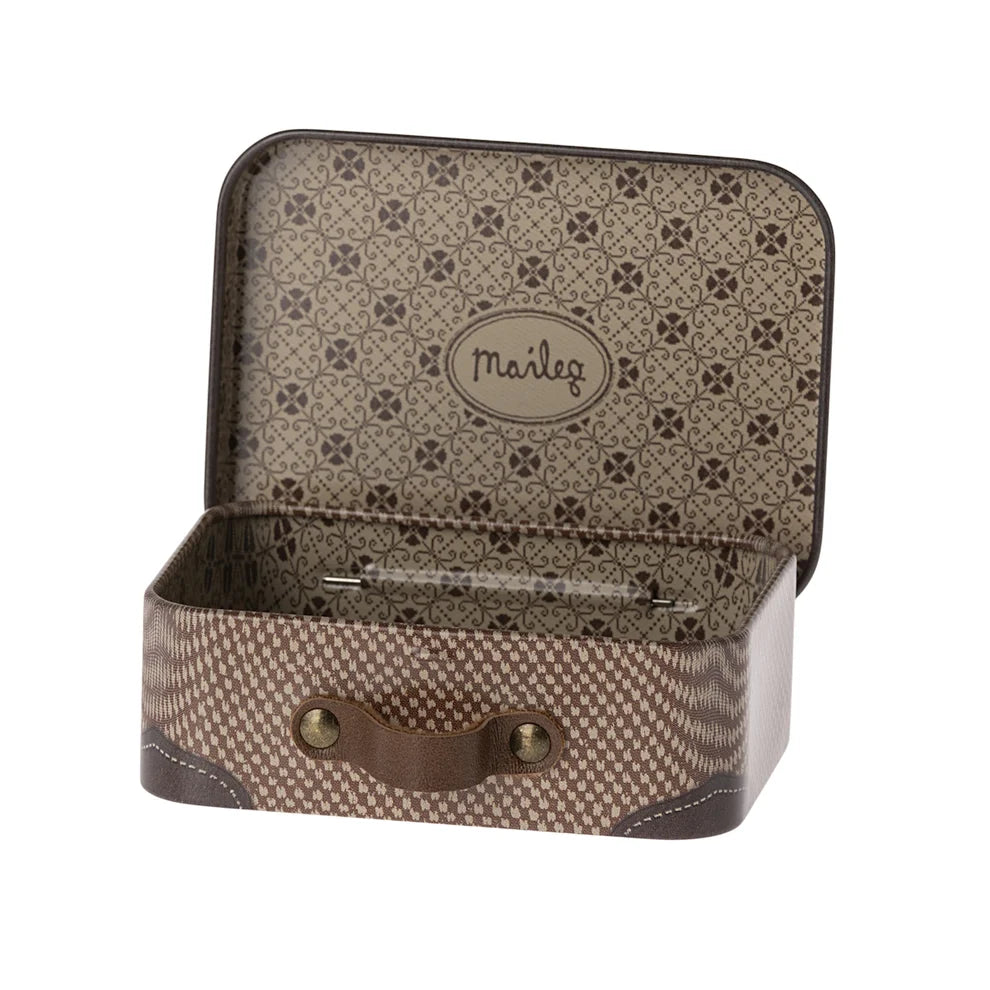 An open vintage-style metal travel case with a patterned brown and beige exterior and interior, featuring a leather handle and a visible 'Maelg' logo on the inside lid, set against a plain white background.